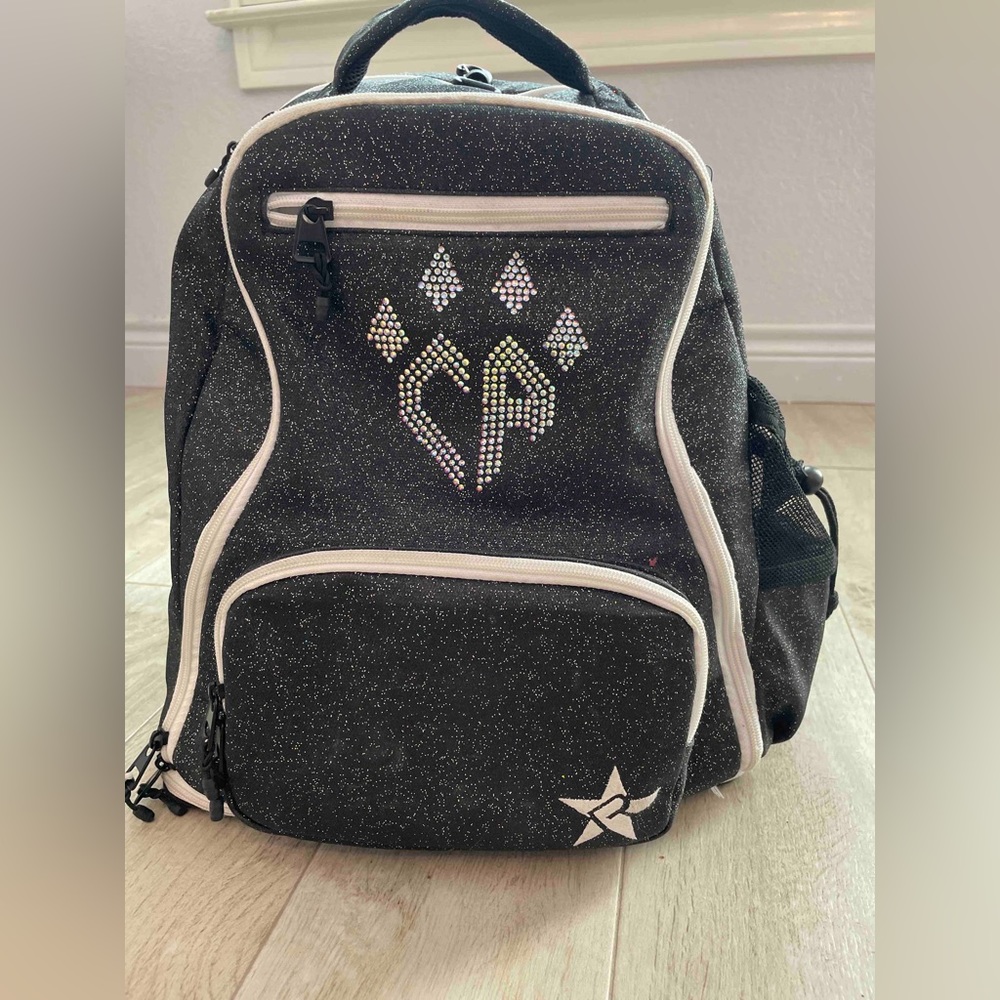 Rebel Dream Bag in black. Used for 2 seasons. No rips, stains, or gems missing.